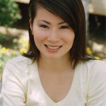 Photo of actress Joan Wong, wearing a white top