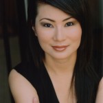 Photo of actress Joan Wong, wearing a black top